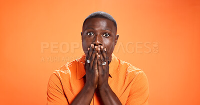 Buy stock photo Man, reaction and surprised by news, portrait or expression for gossip, orange background or studio. Mockup space, black person and shocked by rumor, wow and listening to announcement in Kenya