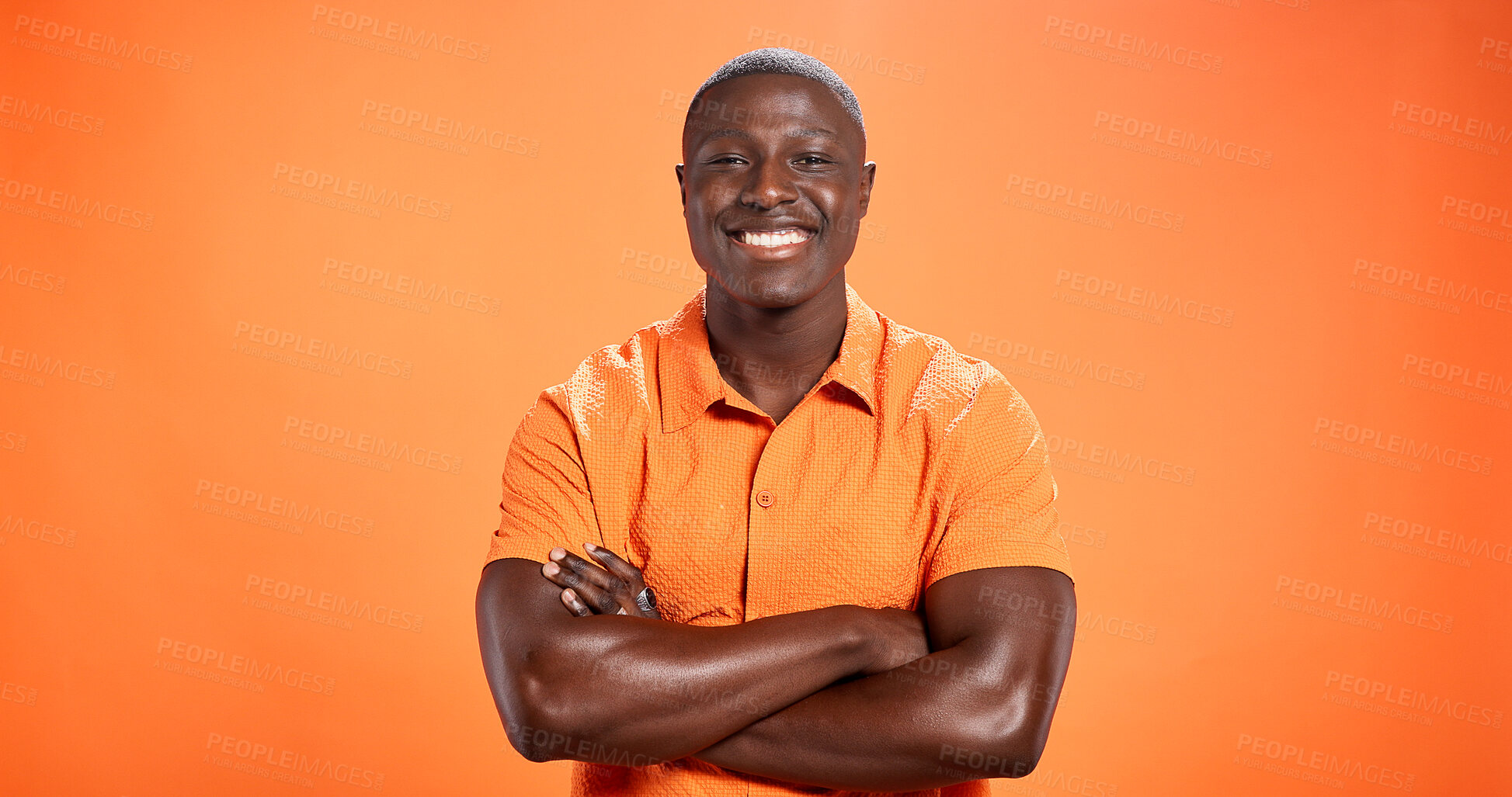 Buy stock photo Fashion, confidence and portrait of black man in studio with trendy clothes, outfit and cool style. Crossed arms, mockup space and person with happy attitude, pride and smile on orange background