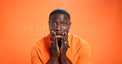 Buy stock photo Studio, man and surprised by news, portrait or reaction for gossip, orange background or expression. Mockup space, black person and shocked by rumor, wow and listening to announcement in Kenya