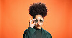 African woman, sunglasses and fashion in studio background, trendy clothes and bold style. Mockup space, female person and shades for retro aesthetic, elegant outfit and positive attitude as designer