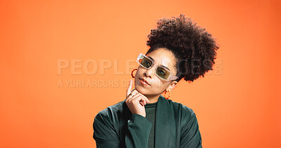 Buy stock photo Sunglasses, thinking and woman in studio for reflection, solution or fashion on orange background. African person, shades and thoughts with idea, wonder or decision for cool style on mockup space