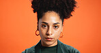 Serious, studio and portrait of business woman with pride, confidence and attitude for creative career. Fashion, design, startup and face of person on orange background for designer brand and stylist