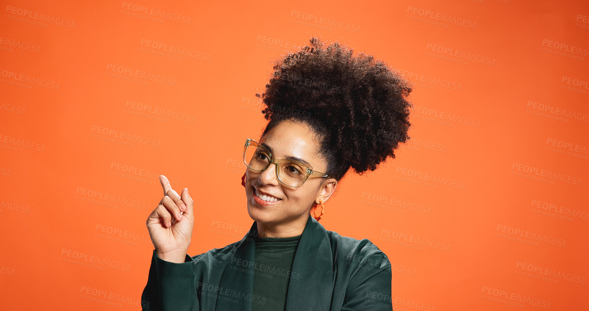 Buy stock photo Show, pointing and space with woman in studio for presentation, announcement and idea. Smile, advertising and opinion with person on orange background for launch news, promotion and direction