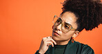 Thinking, mockup and glasses with woman in studio for idea, fashion decision and reflection. Vision, wardrobe inspiration and brainstorming with person on orange background for solution and space