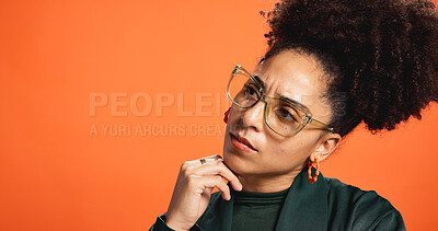 Buy stock photo Thinking, mockup and glasses with woman in studio for idea, fashion decision and reflection. Vision, wardrobe inspiration and brainstorming with person on orange background for solution and space