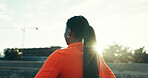 Fitness, running and back of woman in city for workout, training or activity in morning. Sports, break and female athlete with cardio exercise for marathon, race or competition practice in town.