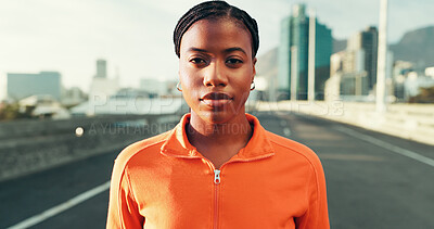 Buy stock photo Serious, fitness and portrait of black woman in city for running, workout or training for marathon. Confident, sports and African female athlete from Kenya with cardio exercise on bridge in town.