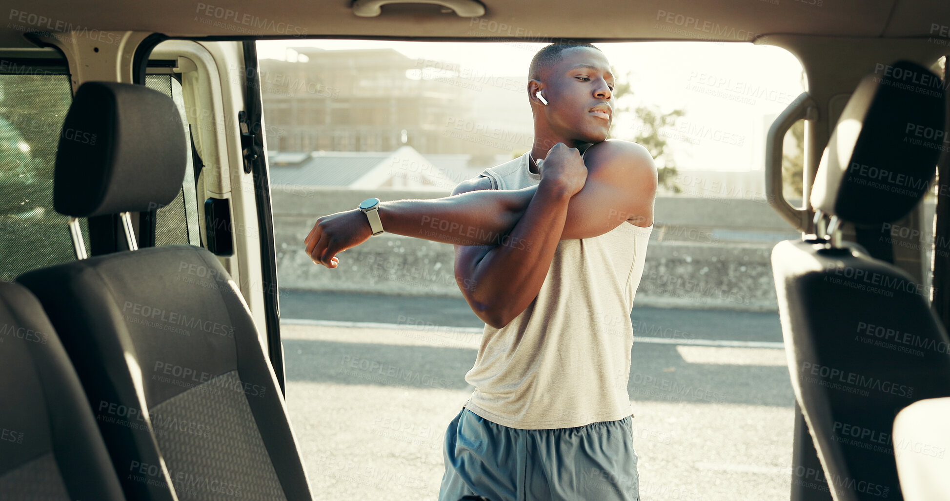 Buy stock photo Black man, fitness or stretching arm in city for workout preparation, exercise or physical activity. Active, male person or African athlete getting ready with warm up by car or vehicle for training