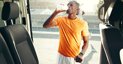 Buy stock photo Athlete, break and black man with drinking water by car for hydration, thirst or running fatigue. Fitness, runner and liquid bottle at roadside for exercise refresh, marathon recovery and performance