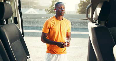Buy stock photo Fitness, runner or earphones with music by car to start training, workout playlist or warm up song. Sports, black man and listen to audio on roadside for running break, cardio podcast or ready to jog