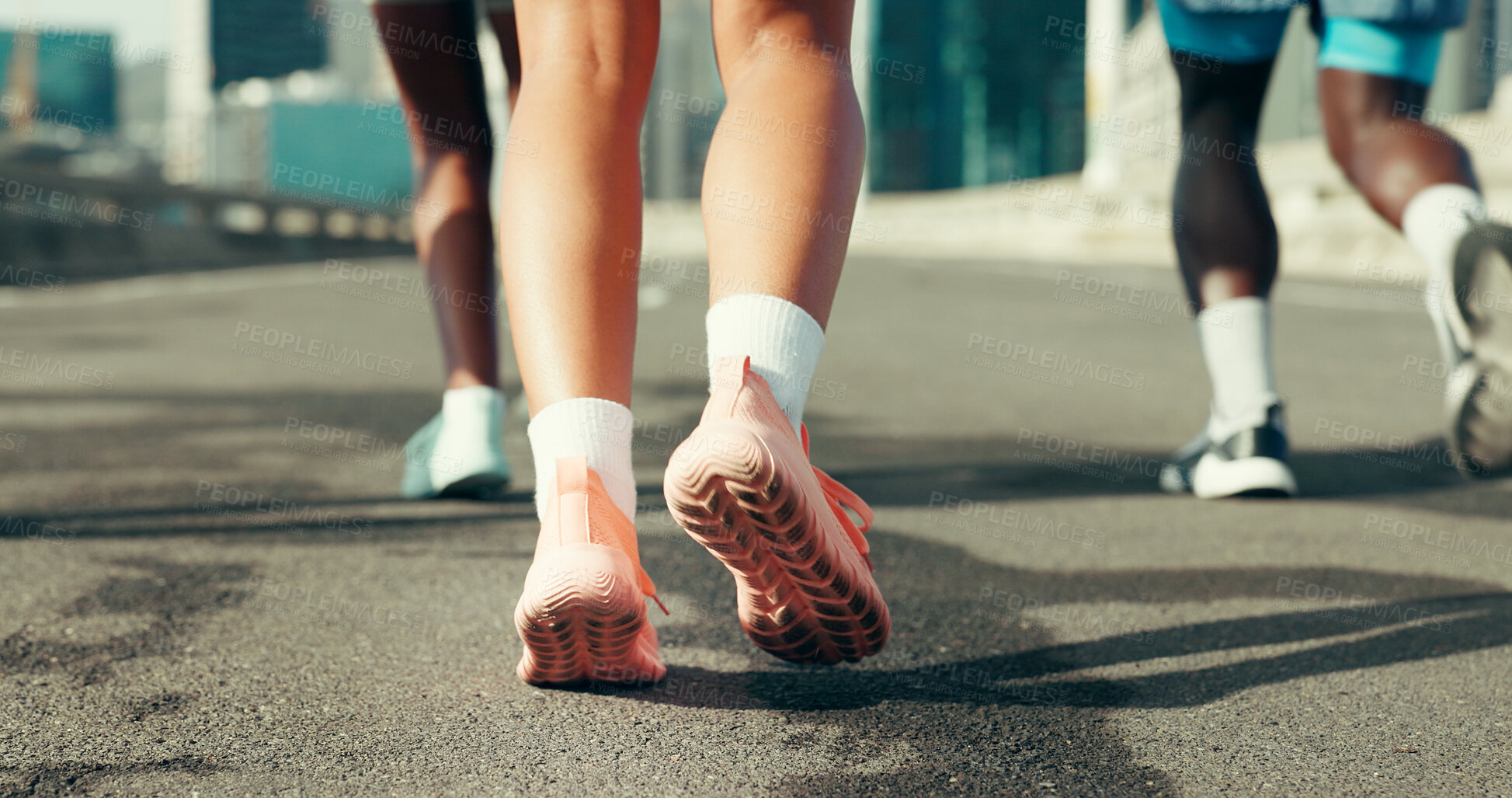 Buy stock photo Running, shoes and fitness with people in city for marathon, workout and training performance. Sports athlete, exercise and feet with group of friends in street for challenge, cardio and wellness