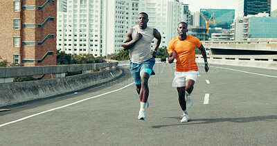 Buy stock photo Running, race and fitness with black men in city for marathon, workout and training performance. Sports athlete, exercise and speed with African friends in street for challenge, cardio and wellness