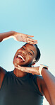 Runner, hands frame and portrait with black woman in city for fitness, photography and wellness. Happiness, workout and marathon with low angle of person on blue sky for space, picture and smile