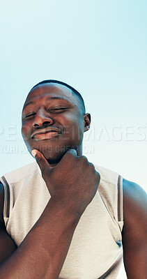 Buy stock photo Below, fitness and portrait of confident black man for running, exercise and workout outdoor. Happy, blue sky and person with attitude for marathon training, sports and challenge with mockup space