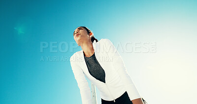 Buy stock photo Fitness, tired and woman rest outdoor for health, wellness or exhausted with intense cardio. Runner, fatigue and relax on break by blue sky for exercise, challenge or recovery with space in low angle