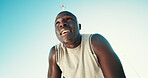 Fitness, tired and black man on break with sweat outdoor for health, wellness and exhausted. Runner, fatigue and rest to relax by blue sky for exercise, recovery and below with space in low angle