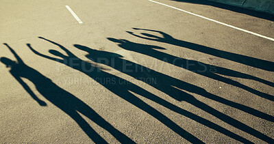 Buy stock photo People, shadow and road of community in unity for achievement, winning or fitness together. Silhouette, group or active team in celebration for workout success, exercise or victory in city street