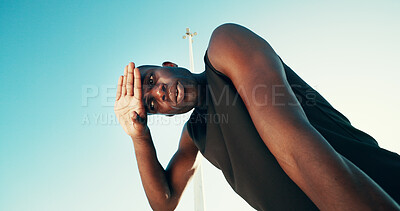 Buy stock photo Tired, fitness and black man by blue sky for running, workout or training for marathon with break. Fatigue, sweating and African male athlete with rest for outdoor cardio exercise from below.