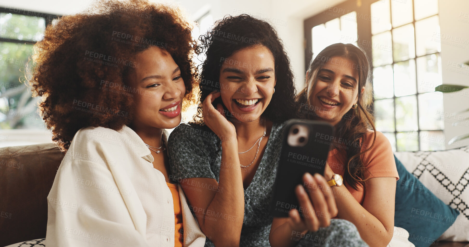 Buy stock photo Phone, laughing and relax with friends on sofa for support, bonding and social media together. Post update, smile and connection with women in living room of home for love, reunion and online meme