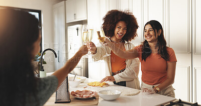 Buy stock photo Women, friends and cooking with toast, champagne and happy with bonding, love and reunion in home. People, wine glass and smile with celebration, ingredients and pizza with group in kitchen at house
