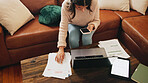 Woman, finance and smartphone in home for documents, debt or above with fintech for easy payment on sofa. Person, phone and mobile app with paperwork, bills and laptop for credit score at apartment