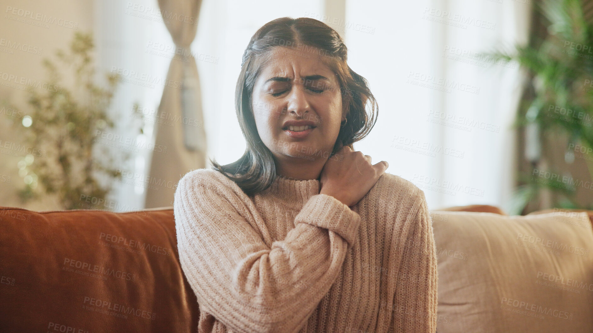 Buy stock photo Woman, injury and stress for shoulder pain on sofa with inflammation, muscle tension or discomfort. Sore, person and joint ache in home with fibromyalgia, osteoporosis and uncomfortable with pressure