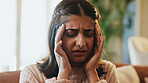 Woman, pain and headache of stress in home for financial crisis, mortgage debt or overwhelmed. Anxiety, person or tension migraine on sofa for overthinking, uncomfortable ache or dizzy for bankruptcy