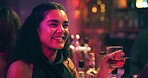 Woman, smile and talk with drinks at nightclub with celebration, party and social event at bar. Friends, girl and discussion with whiskey, alcohol and excited with beverage for new years eve at pub