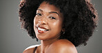 Smile, beauty and portrait of black woman in studio for hair care, texture and growth. Happy, mockup space and person with natural hairstyle for wellness, grooming and health on gray background