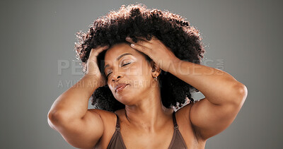 Buy stock photo Haircare, pride and woman with afro in studio for healthy texture, growth results or grooming. Mockup space, african person or natural hairstyle on gray background with conditioning treatment or glow