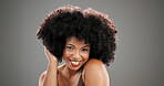Beauty, portrait and woman with afro in studio with healthy texture, growth results and volume. Haircare, african person and happy with hairstyle on gray background for self care glow and maintenance