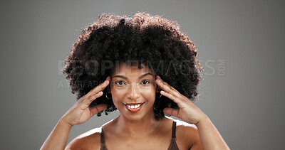 Buy stock photo Natural, beauty and portrait of black woman in studio for hair care, healthy texture or growth. Smile, mockup space and person with afro hairstyle for wellness, grooming or glow on gray background