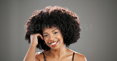 Buy stock photo Happy, beauty and portrait of African woman in studio for hair care, healthy texture or growth. Smile, mockup space and person with natural hairstyle for wellness, grooming or glow on gray background