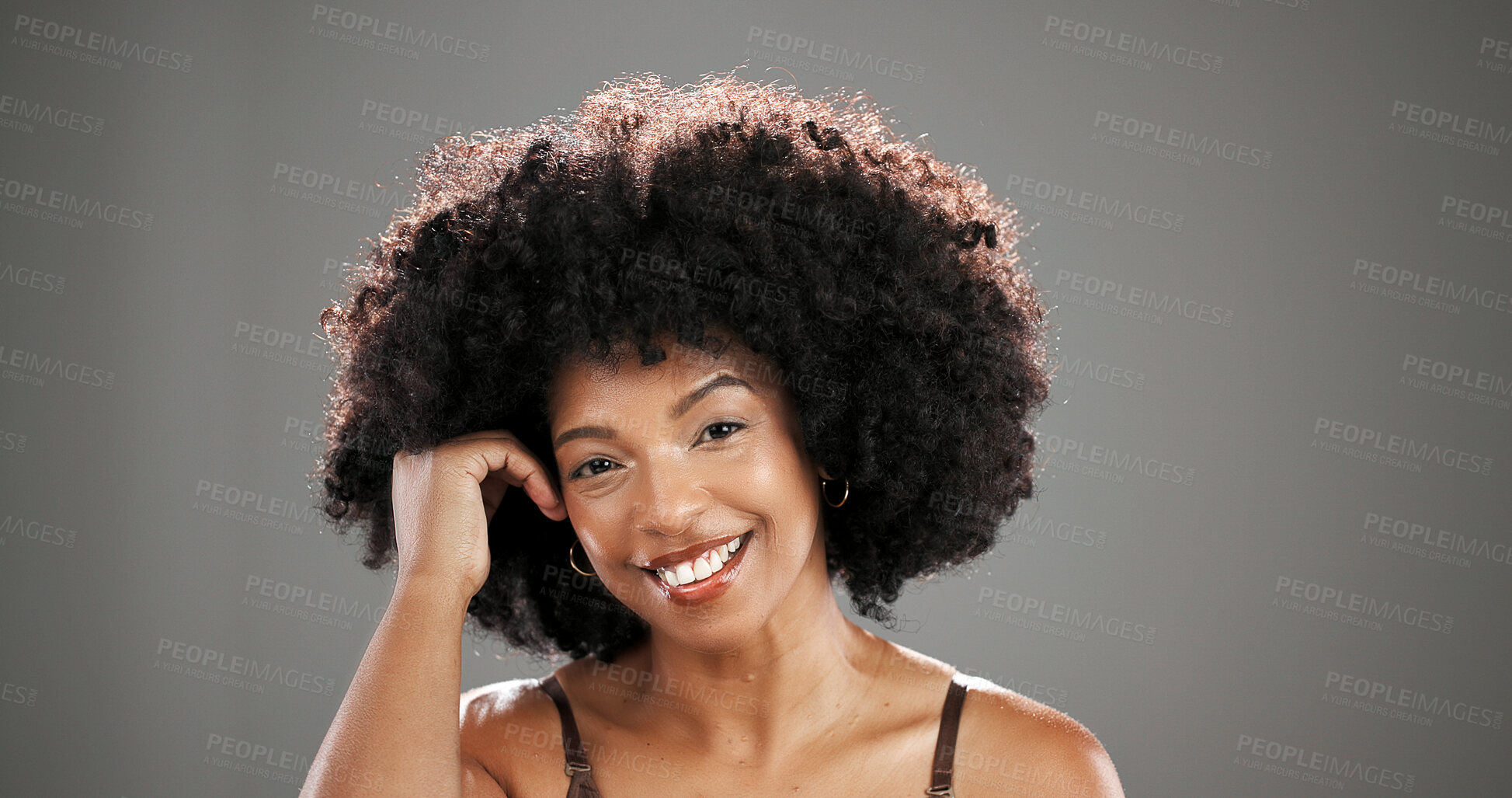 Buy stock photo Happy, beauty and portrait of African woman in studio for hair care, healthy texture or growth. Smile, mockup space and person with natural hairstyle for wellness, grooming or glow on gray background
