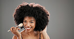 Makeup brush, happy and portrait of black woman in studio for foundation, cosmetics and beauty products. Salon, mockup and person with tools for skincare, makeover and aesthetic on gray background