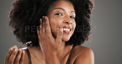 Buy stock photo Beauty, portrait and woman with serum in studio for retinol treatment, hydration and skincare. Cosmetics, African person and collagen oil application for skin regeneration and glow on gray background