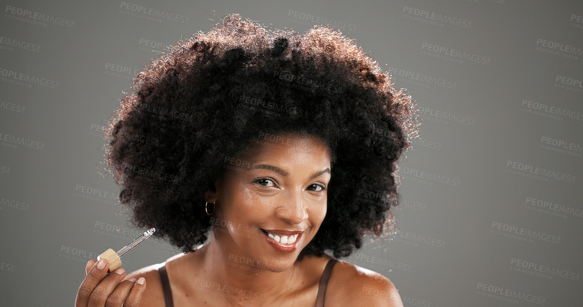 Buy stock photo Skincare, portrait and woman with serum in studio for wrinkle treatment, hydration or natural beauty. Mockup, African person and happy with cosmetics dropper for skin regeneration on gray background