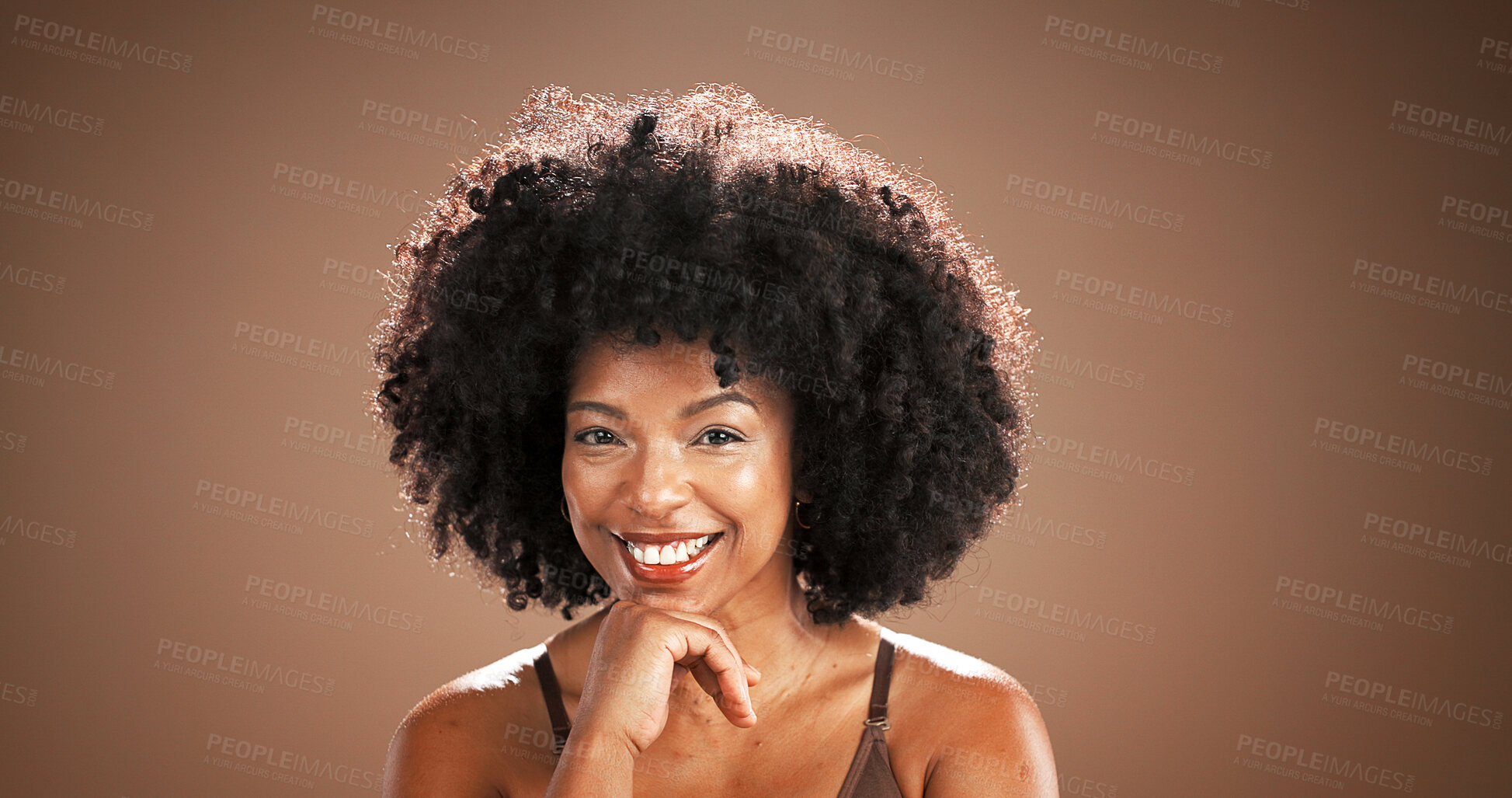 Buy stock photo Hair, beauty and portrait of black woman in studio for health, texture and growth on brown background. Salon, mockup space and person with natural hairstyle, afro and happy for wellness and grooming