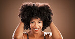 Hair, happy and portrait of black woman on brown background for health, texture and growth in studio. Salon, mockup space and person with natural hairstyle, afro and beauty for wellness and grooming