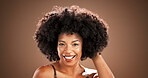 Hair, smile and portrait of black woman in studio for health, texture and growth on brown background. Salon, mockup space and person with natural hairstyle, afro and beauty for wellness and grooming
