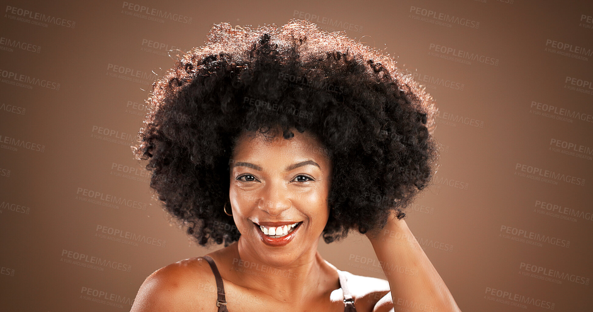 Buy stock photo Hair, smile and portrait of black woman in studio for health, texture and growth on brown background. Salon, mockup space and person with natural hairstyle, afro and beauty for wellness and grooming
