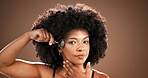 Skincare, portrait and woman with jade roller in studio for lymphatic drainage, radiance or routine. Mockup, mature black person or cosmetics tool for anti aging or natural beauty on brown background