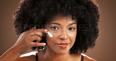 Buy stock photo Skincare, woman and smile with face cream in studio for hydration, cosmetics or hyaluronic acid. Beauty, portrait or black person with moisturizer on brown background for anti aging treatment or glow