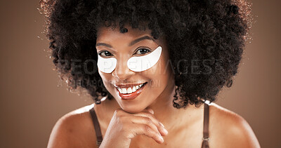 Buy stock photo Skincare, eye mask and portrait of black woman on brown background for facial, dark circles and wellness. Dermatology, collagen and face of person for beauty, anti aging and cosmetics for health