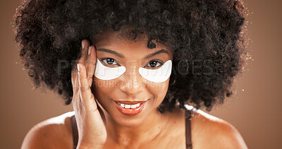 Buy stock photo Facial, eye mask and portrait of black woman on brown background for skincare, dark circles and wellness. Dermatology, collagen and face of person for beauty, anti aging and cosmetics for health