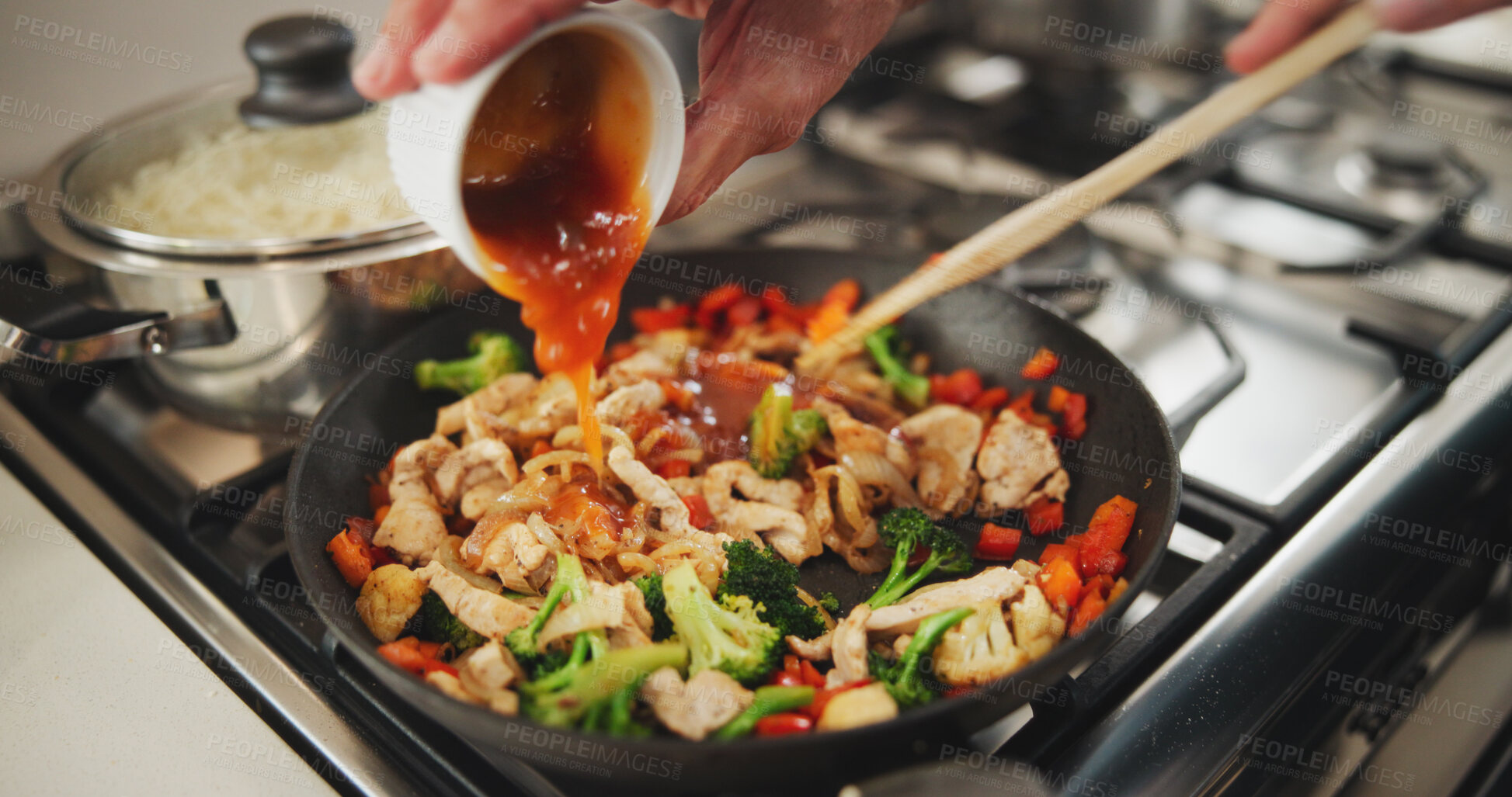 Buy stock photo Cooking, hands and chef with sauce for cuisine, flavor or mixing of dish with ingredients or dinner. Kitchen, entrepreneur and person with gravy for gourmet, meal prep and healthy food for home