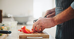 Peppers, hands and man cutting vegetables in home for cooking healthy dinner, meal or supper for diet. Knife, groceries and chef chop fresh ingredients for wellness, nutrition or recipe in kitchen.