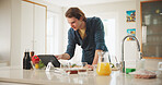 Kitchen, learning or man on tablet for cooking recipe method, lunch or guide in home. Online tutorial, technology or male person on touchscreen with ingredients instruction, food or meal prep steps