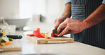 Health, hands and man cutting vegetables in home for cooking dinner, meal or supper for diet food. Knife, ingredients and chef chopping fresh peppers for wellness, nutrition or recipe in kitchen.