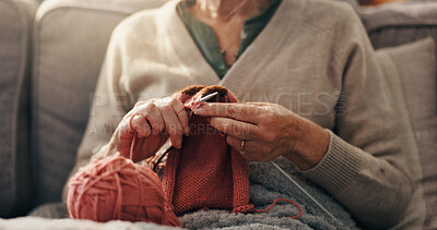 Buy stock photo Senior woman, hands and knit on sofa for retirement hobby, cognitive stimulation or creativity. Wool, yarn or old person with craft in home for handmade jersey, peaceful activity or fine motor skills